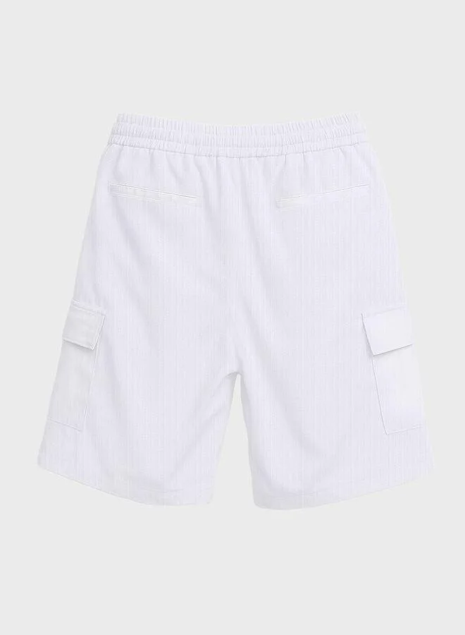 The Indian Garage Co  Men Relaxed Fit Solid Cargo Pocket Mid-Rise Cargo Shorts for Men | Best Price UAE